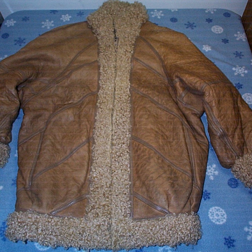 Well worn womens winter coat , good for the farm